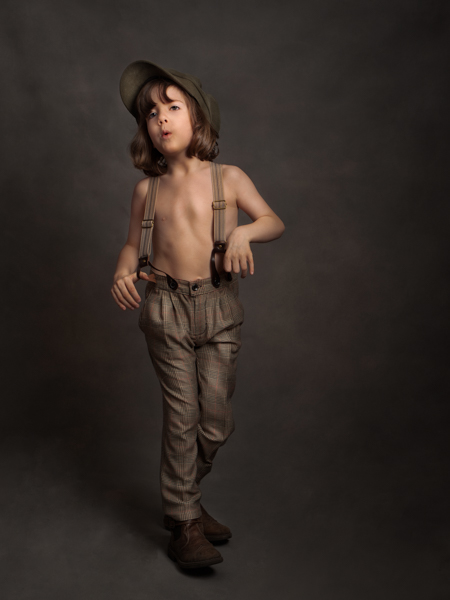 Young boy dressed as a shoe shine boy for fine art photography