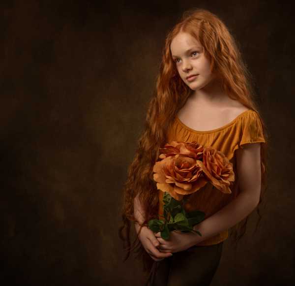 young girl with red hair and flowers