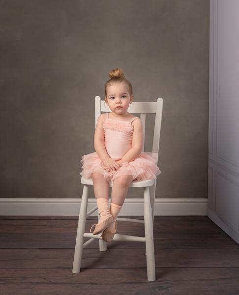 baby ballerina on a white chair