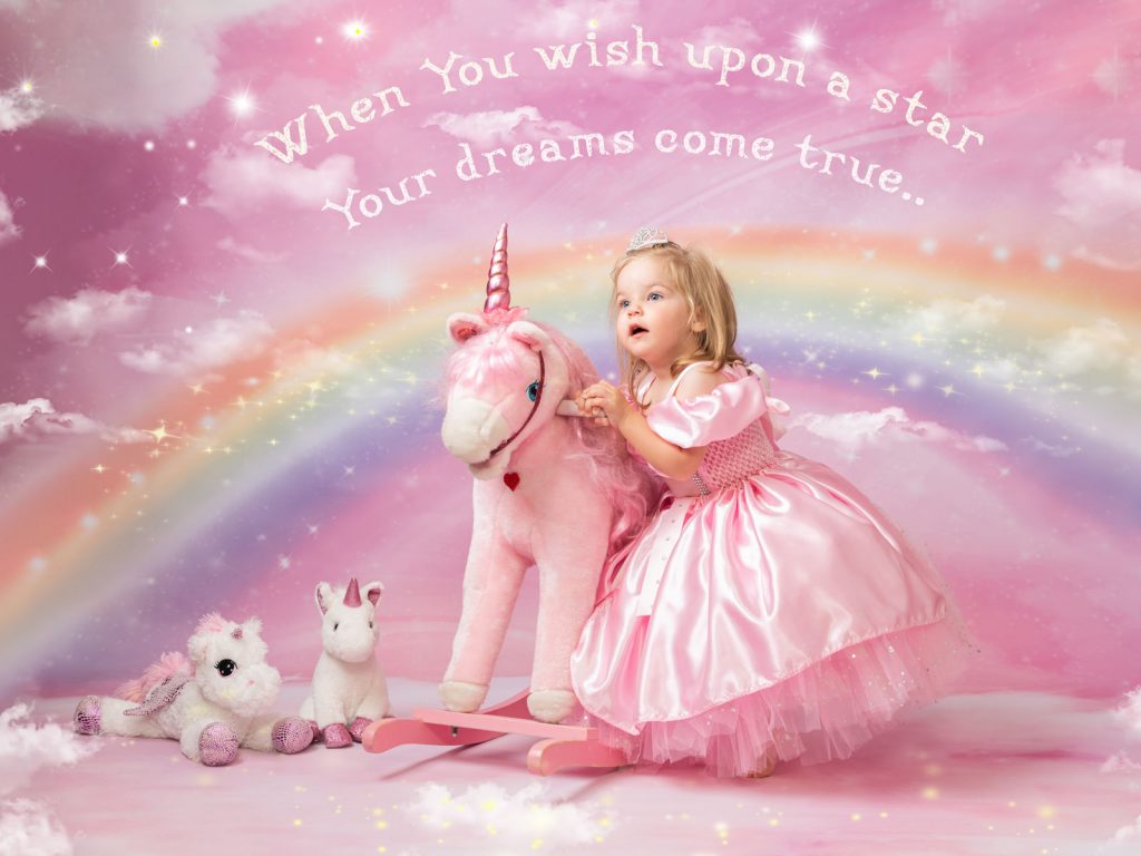 Unicorn and rainbows girl in a princess outfit studio photoshoot