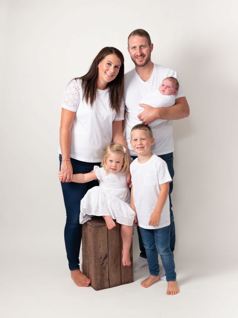 white tops a whole family with children and newborn baby together