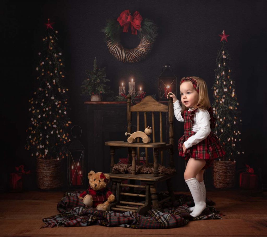 little girl with her Christmas teddy bear fine art Christmas photoshoot