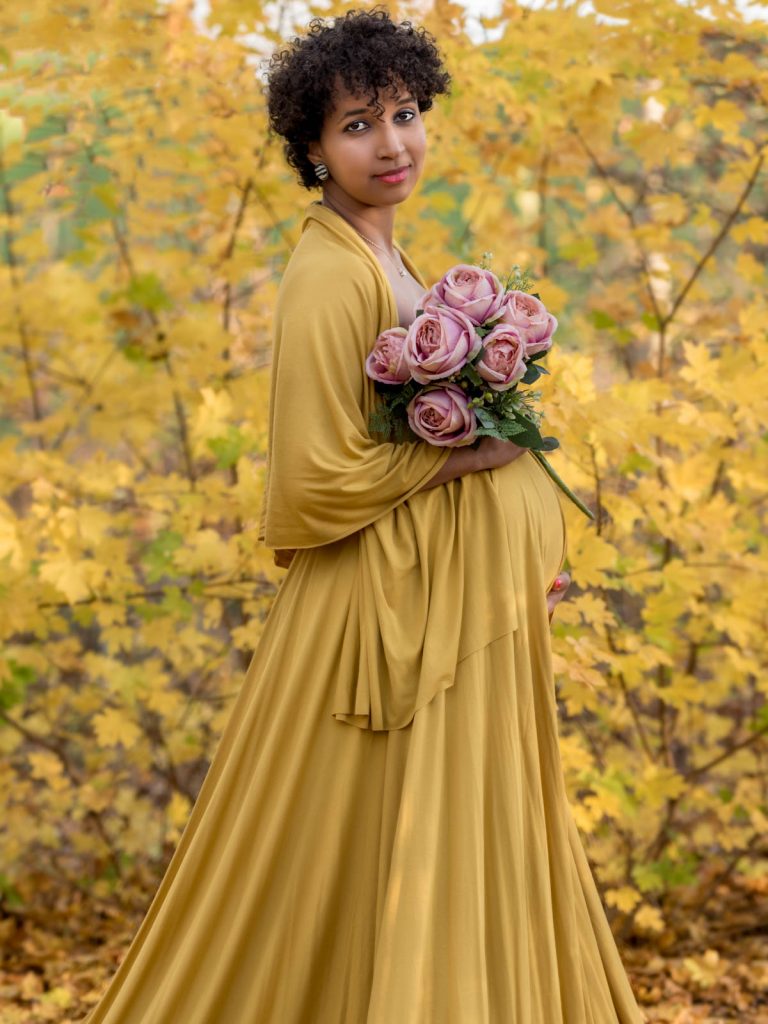 stunning mustard dress with roses maternity photoshoot