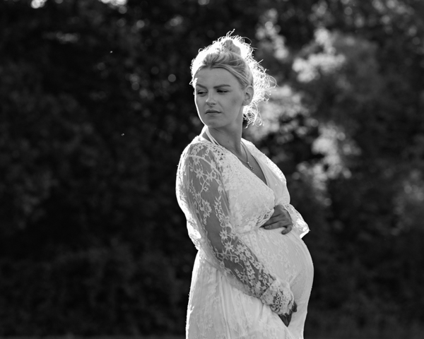 black and white photo of expecting woman