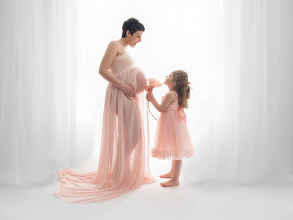 mother and her daughter in a maternity photoshoot