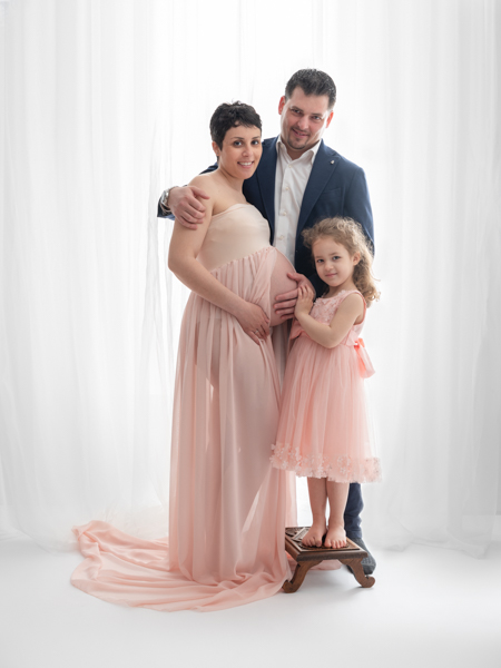 stunning pink dress on pregnant mother and her daughter