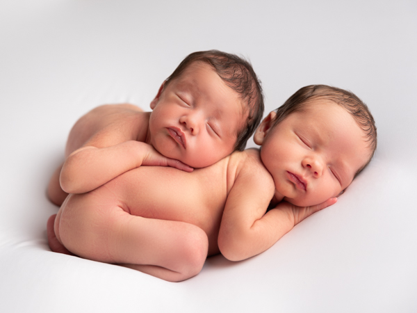 twin newborn babies both asleep
