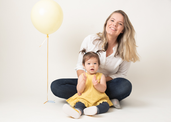 mother and her stunning daughter with a balloon