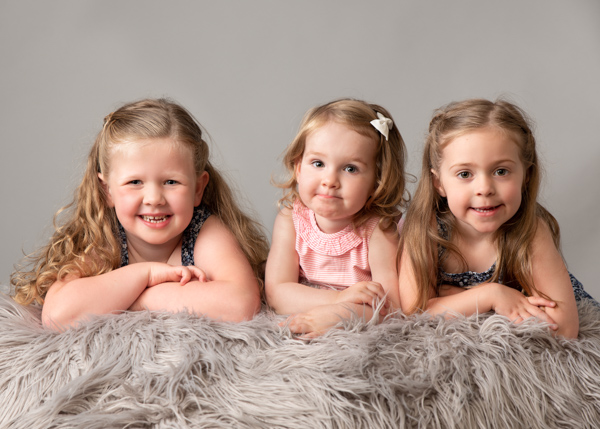 three sisters facing camera kids photoa