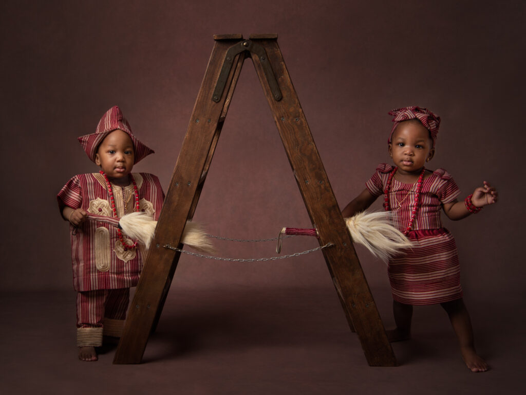 Twin African boy and girl in traditional outfit