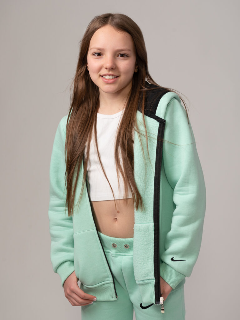 Teenage model in green tracksuit