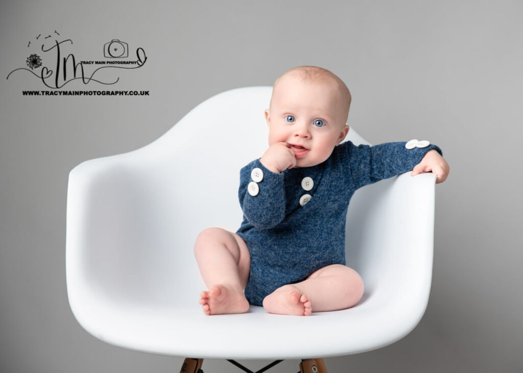 Sitter photography with a smiling baby