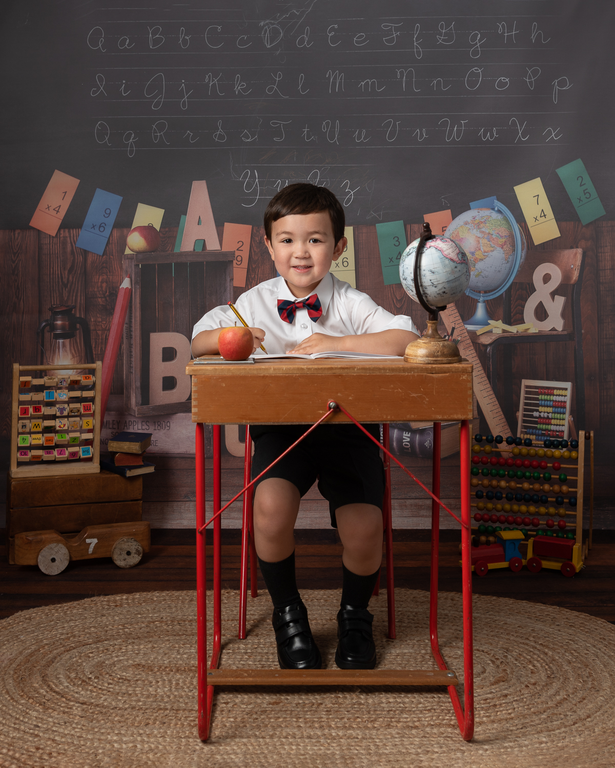 Boy at desk writing Back to school