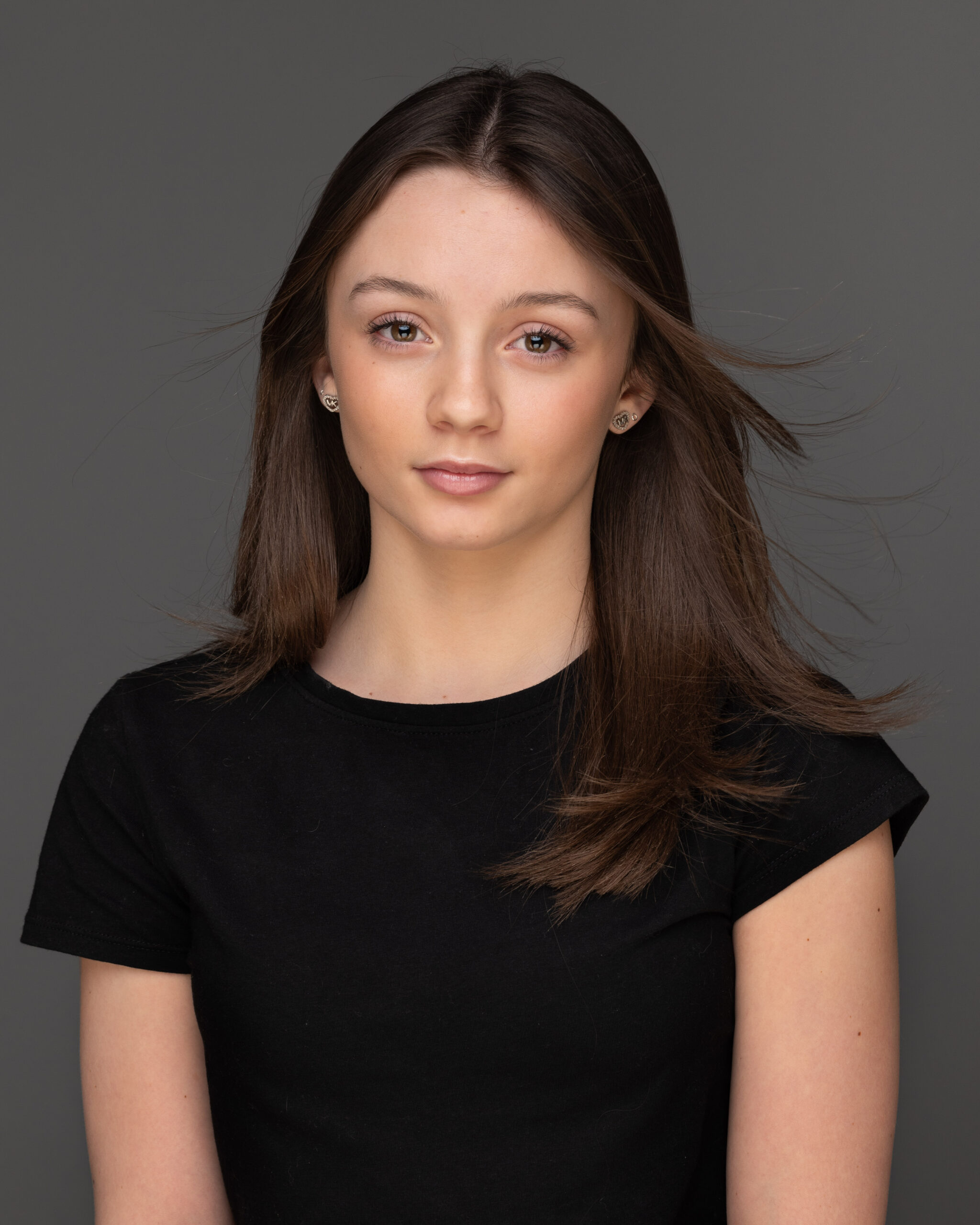 Model headshot attractive girl headshot with hair blowing
