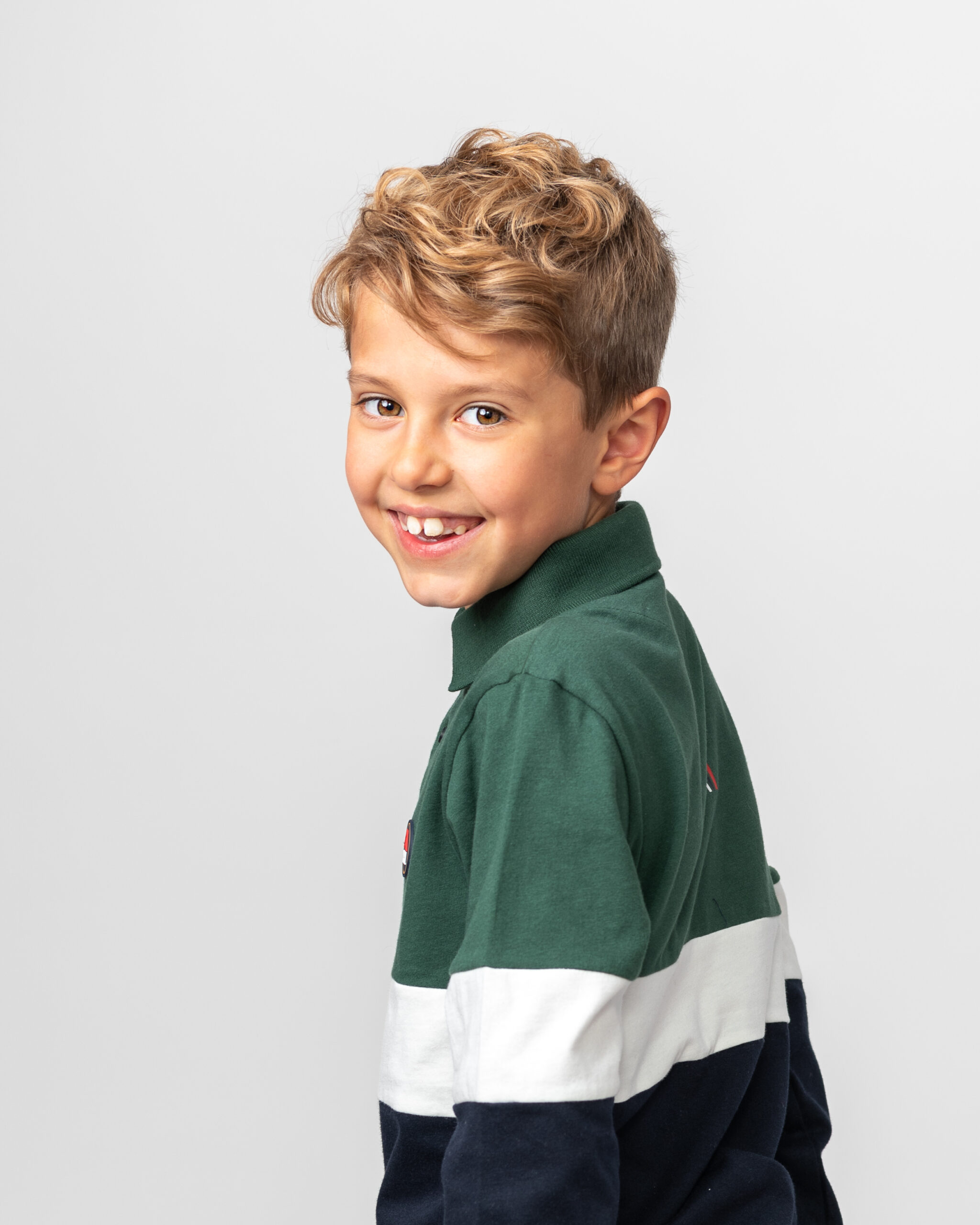 Leo-19-Edit Headshot picture of boy in green blue and white rugby top