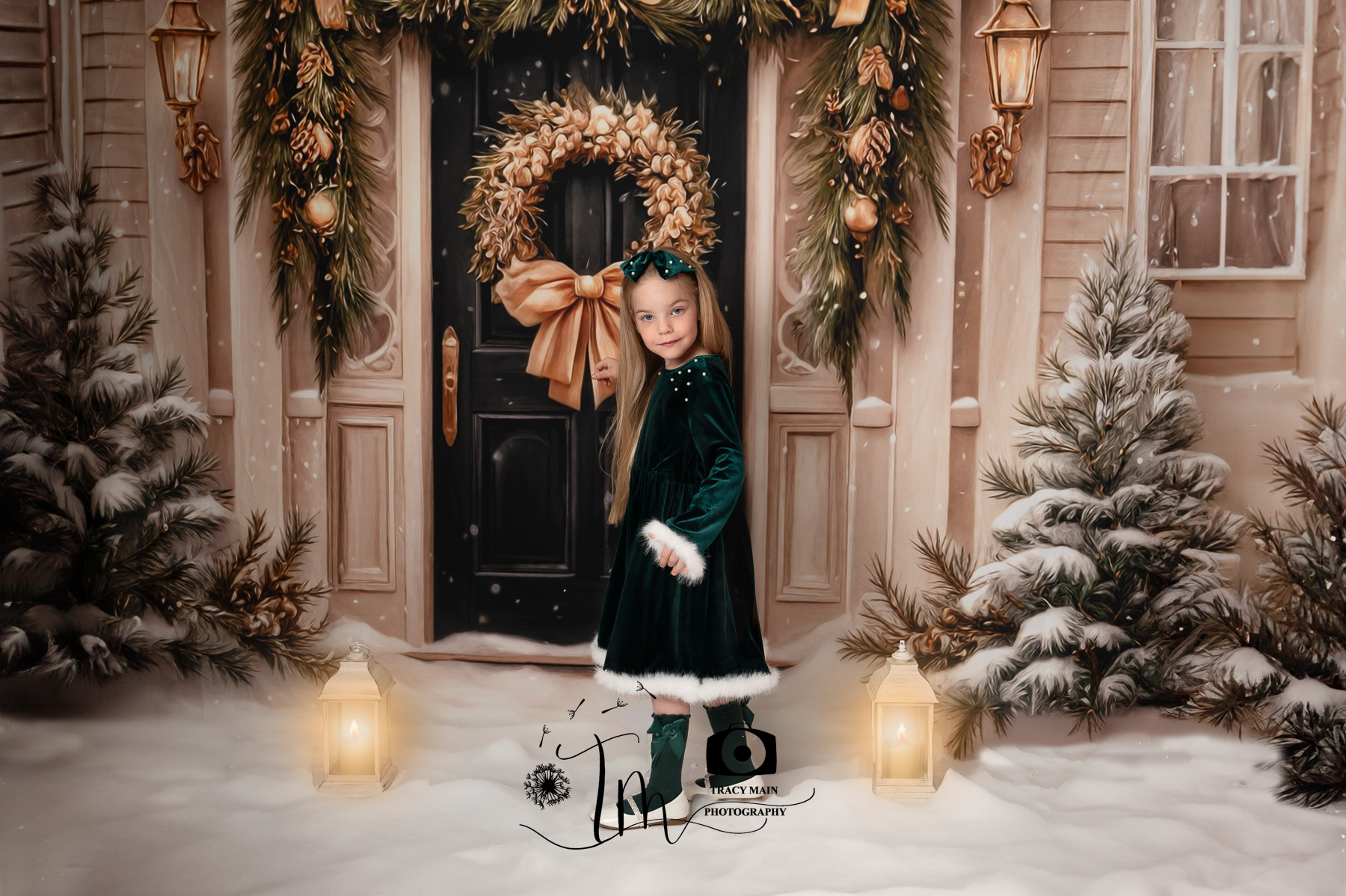 TMP_5444-Edit Christmas photoshoot picture of a girl in a green dress outside a festive black door in the snow